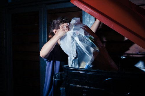Operatives sorting materials during a rubbish removal operation